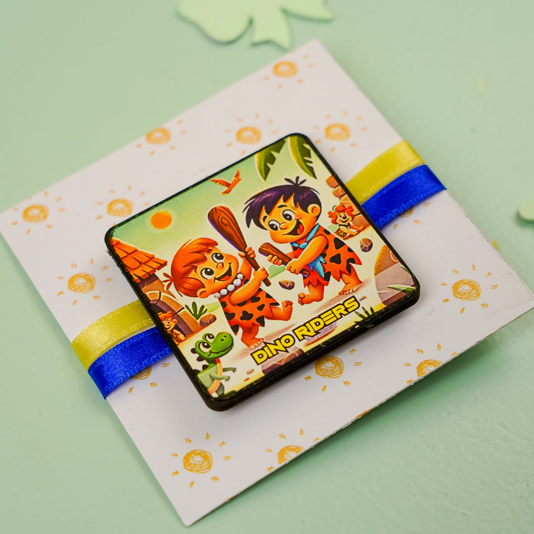 Handmade Reusable Dino Riders Mdf Wood Rakhi With Roli Chawal For Siblings - Angled Close-up on Card