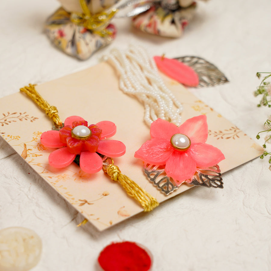 Pink White Pearls And Charm Resin Bracelet Rakhi With Roli Chawal For Bhaiya And Bhabhi - Set Display with Decorative Elements