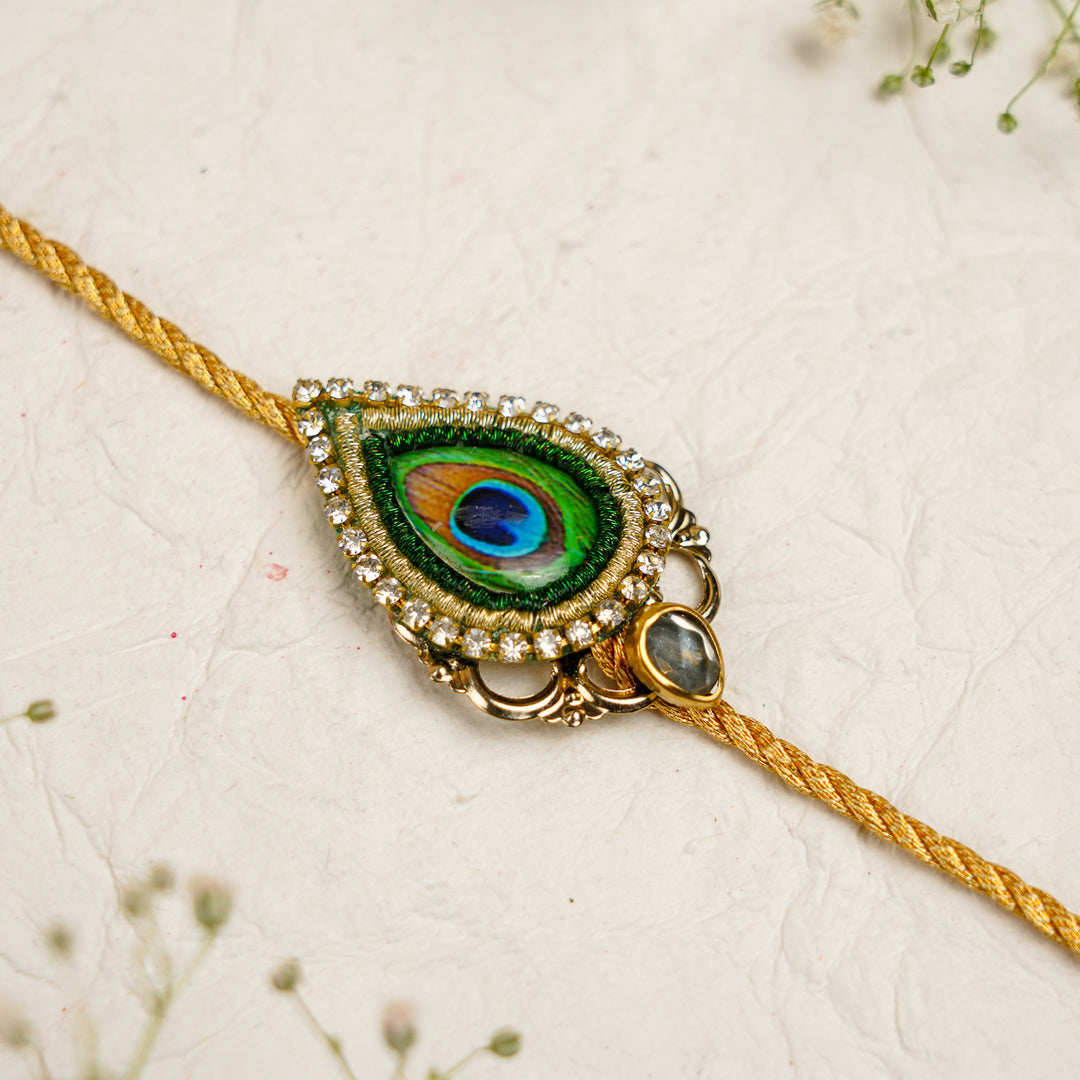 Peacock Pearm And Dori Bracelet Rakhi With Roli Chawal For Bhaiya And Bhabhi - Close-up of Gold Thread Bracelet