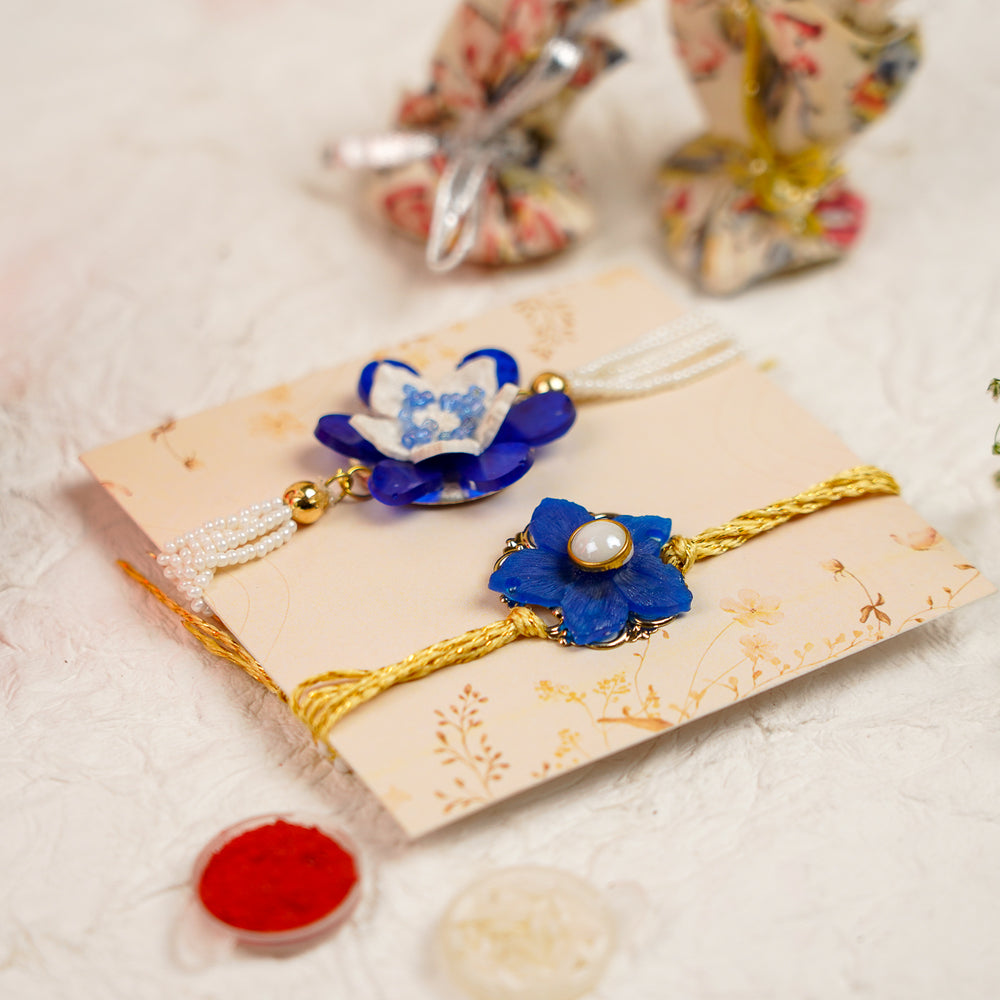 Blue White Pearls And Zari Resin Bracelet Rakhi With Roli Chawal For Bhaiya And Bhabhi - Angled View Showing Depth
