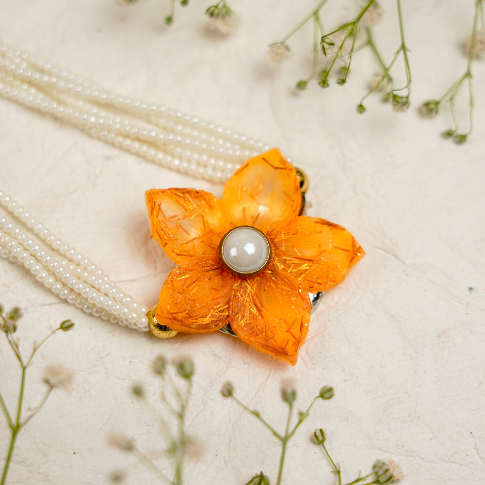 Orange Pearl And Dori Resin Bracelet Rakhi With Roli Chawal For Bhaiya And Bhabhi - Close-up of Pearl Flower Bracelet