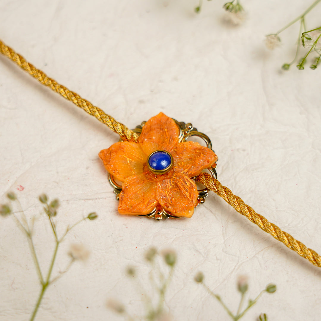 Orange Pearl And Dori Resin Bracelet Rakhi With Roli Chawal For Bhaiya And Bhabhi - Close-up of Blue Stone Bracelet