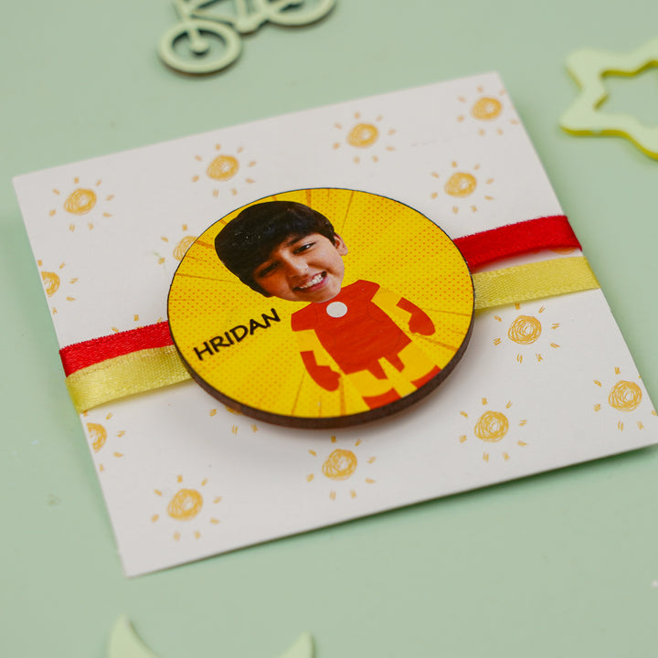 Photo Personalized Handmade Reusable Caricature Iron Man Mdf Wood Kids Rakhi With Roli Chawal - Angle View of Rakhi on Card