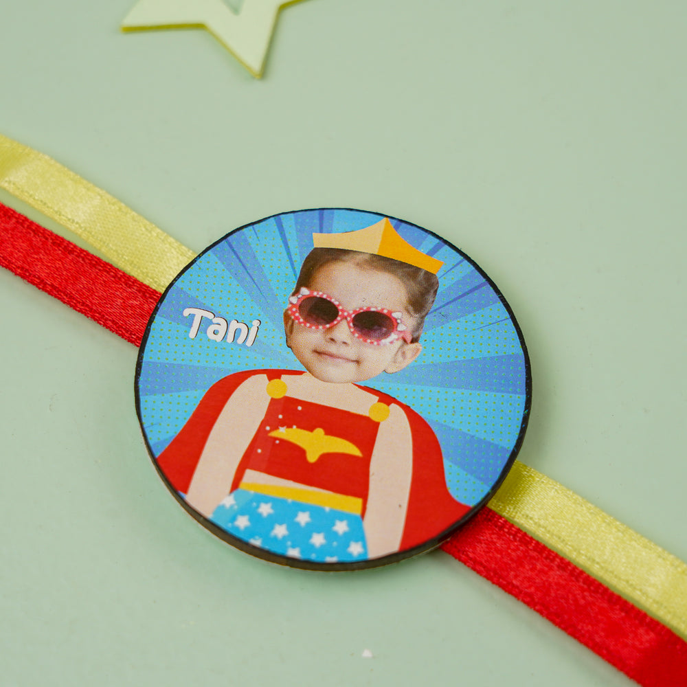 Photo Personalized Handmade Reusable Caricature Wonder Women Mdf Wood Kids Rakhi With Roli Chawal - Close-up on Circular Badge