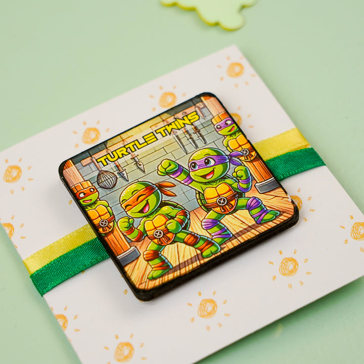 Handmade Reusable Turtle Twins Mdf Wood Rakhi With Roli Chawal For Siblings - Angled view on gift card