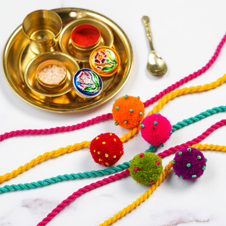 5 pc Rakhi + Brass Thali Set | Premium Mini Laddoo Beaded Pom Pom Rakhi Set with Roli Chawal