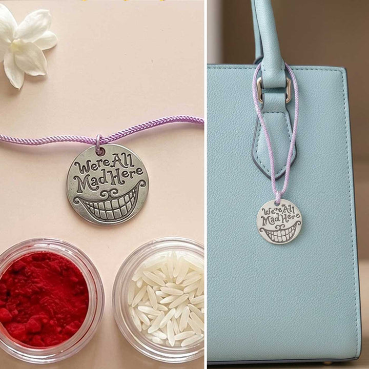 Engraved "We Are All Mad Here" Quote Metal Charm Rakhi With Roli Chawal for Brother