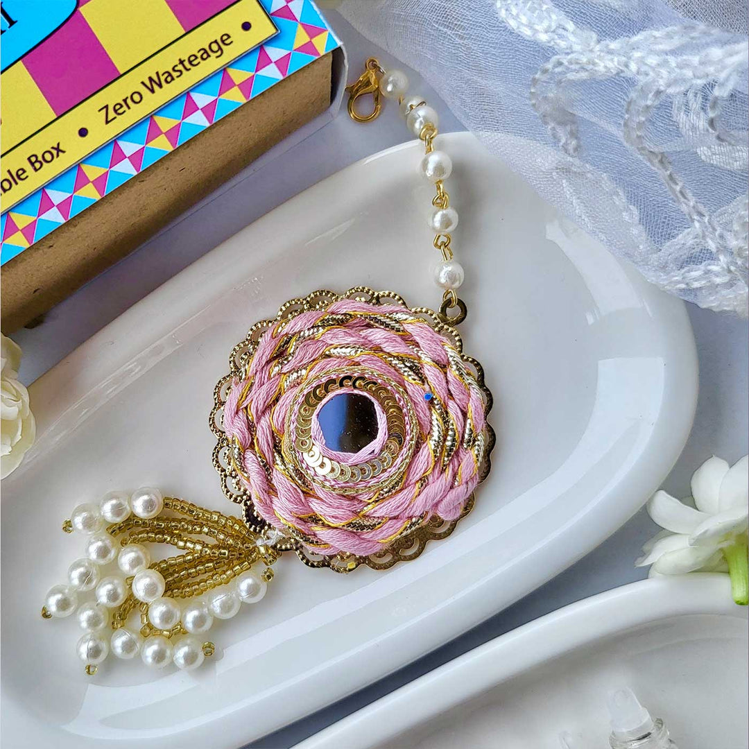 Handmade Mirror Work Braided Rakhi Hamper With Roli Chawal For Bhaiya And Bhabhi - Pink Rakhi Close-up