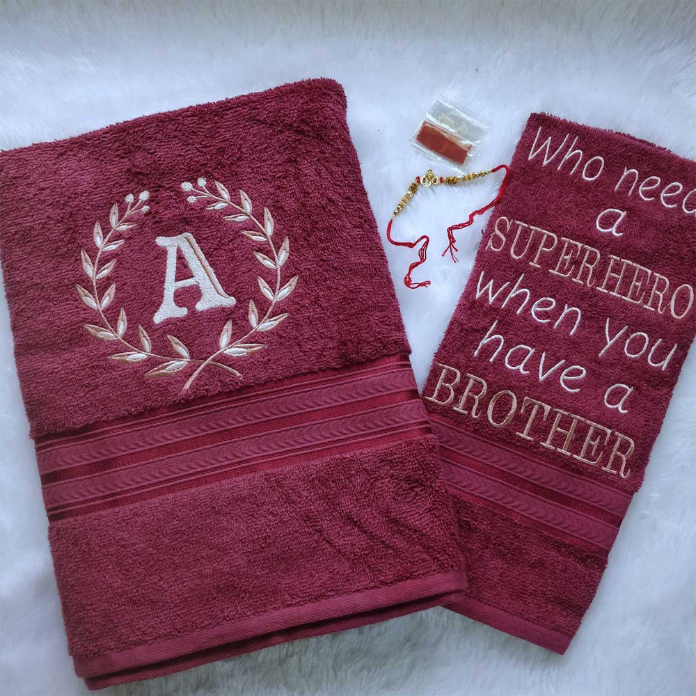 Personalized Embroidered Maroon Cotton Towel Rakhi Hamper With Roli Chawal For Brother Includes 1 Hand Towel 1 Bath Towel And 1 Rakhi - Embroidered Front and Text Close-up
