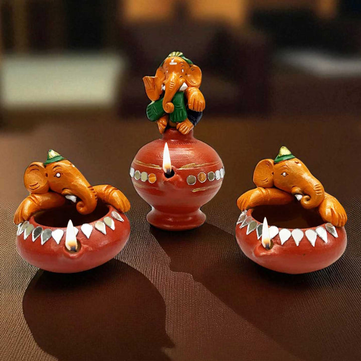 Handmade Painted Ganesh Design Terracotta Oil Lamp / Diya | Includes 1 Magic Diya And 2 Diyas