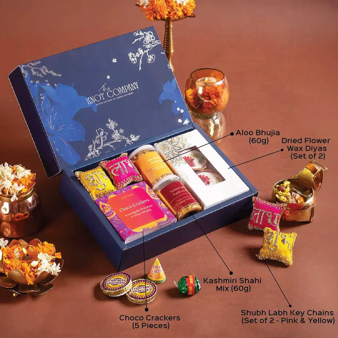 Shubh Blessings of Diwali Gift Hamper | Includes 2 Wax Diyas, 2 Shubh Labh Key Chains, 1 Kashmiri Shahi Mix, 1 Aloo Bhujia, 5 Choco Crackers, 1 Gift Box