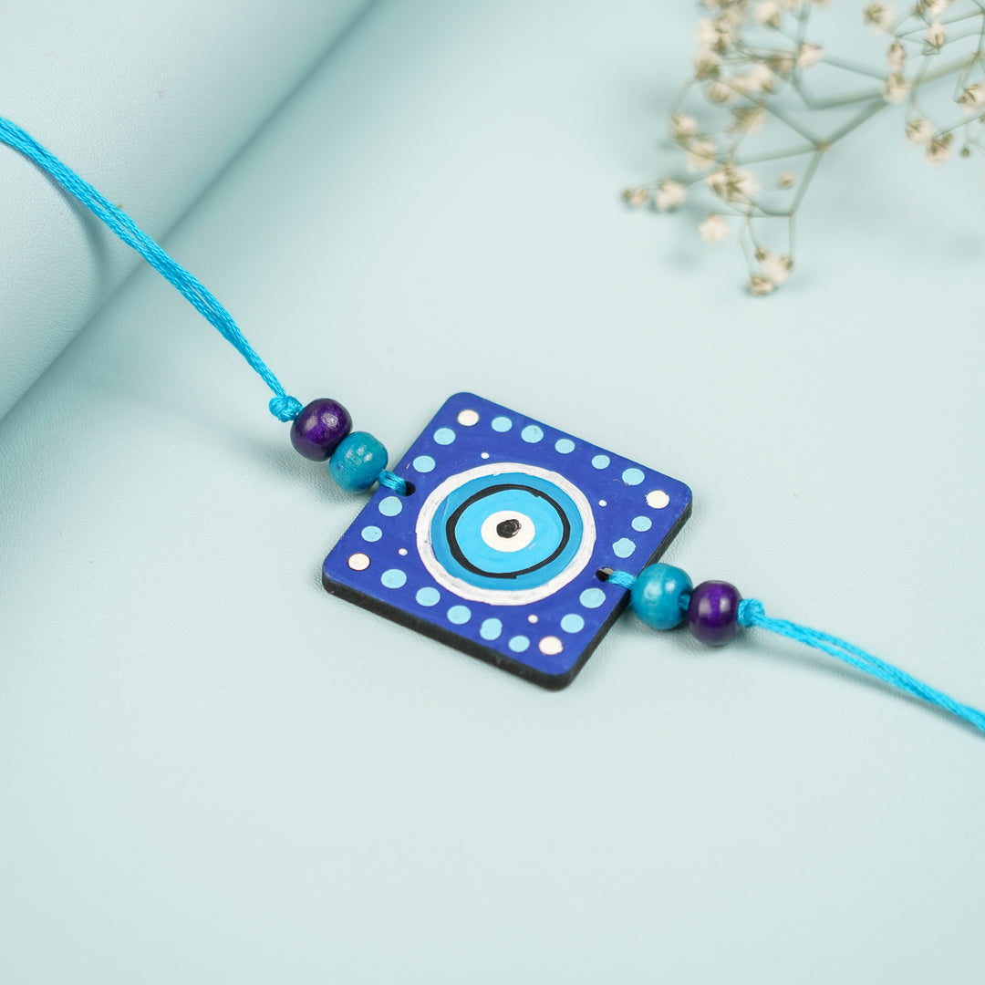 Customized Hand Painted Evil Eye Design Mdf Wood Rakhi - Close-up on Square Pendant Bracelet