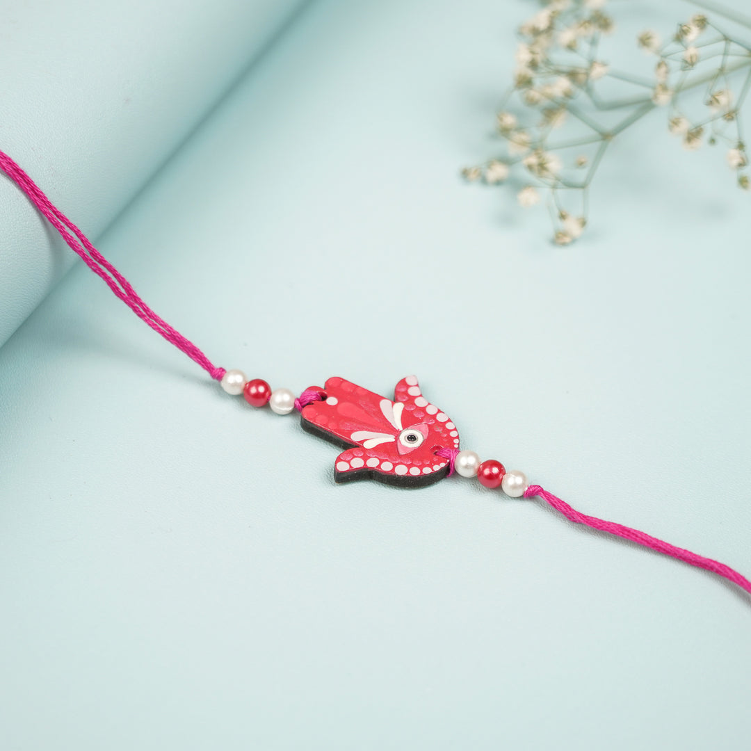 Customized Hand Painted Hamsa Hand Design Mdf Wood Rakhi - Close-up on Surface Display