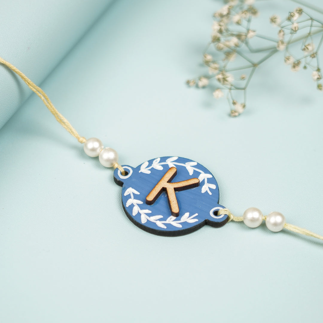 Personalized Hand Painted Layered Monogram Design Mdf Wood Rakhi - Close-up Angle