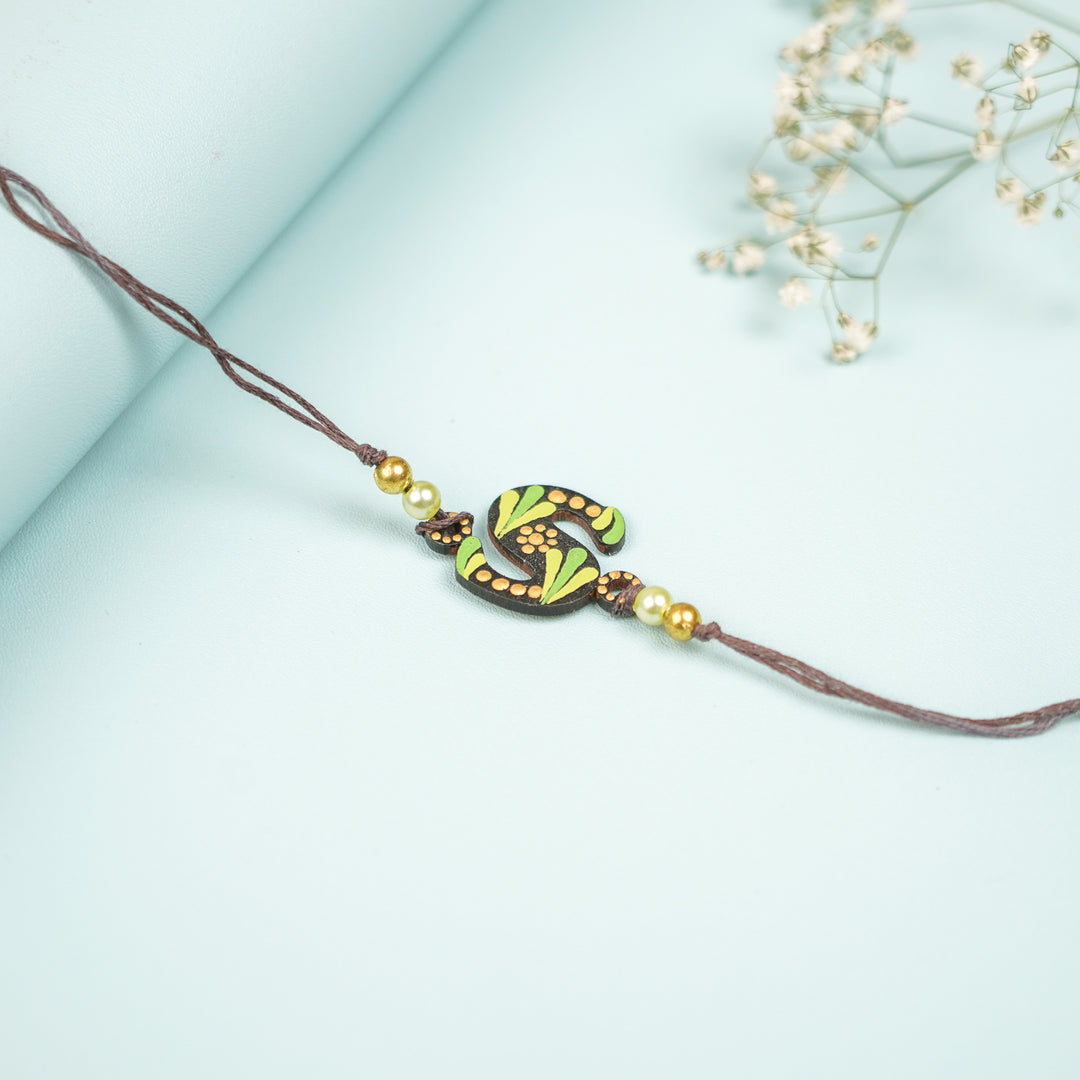 Personalized Hand Painted Dot Mandala Monogram Design Mdf Wood Rakhi - Angled View (5)