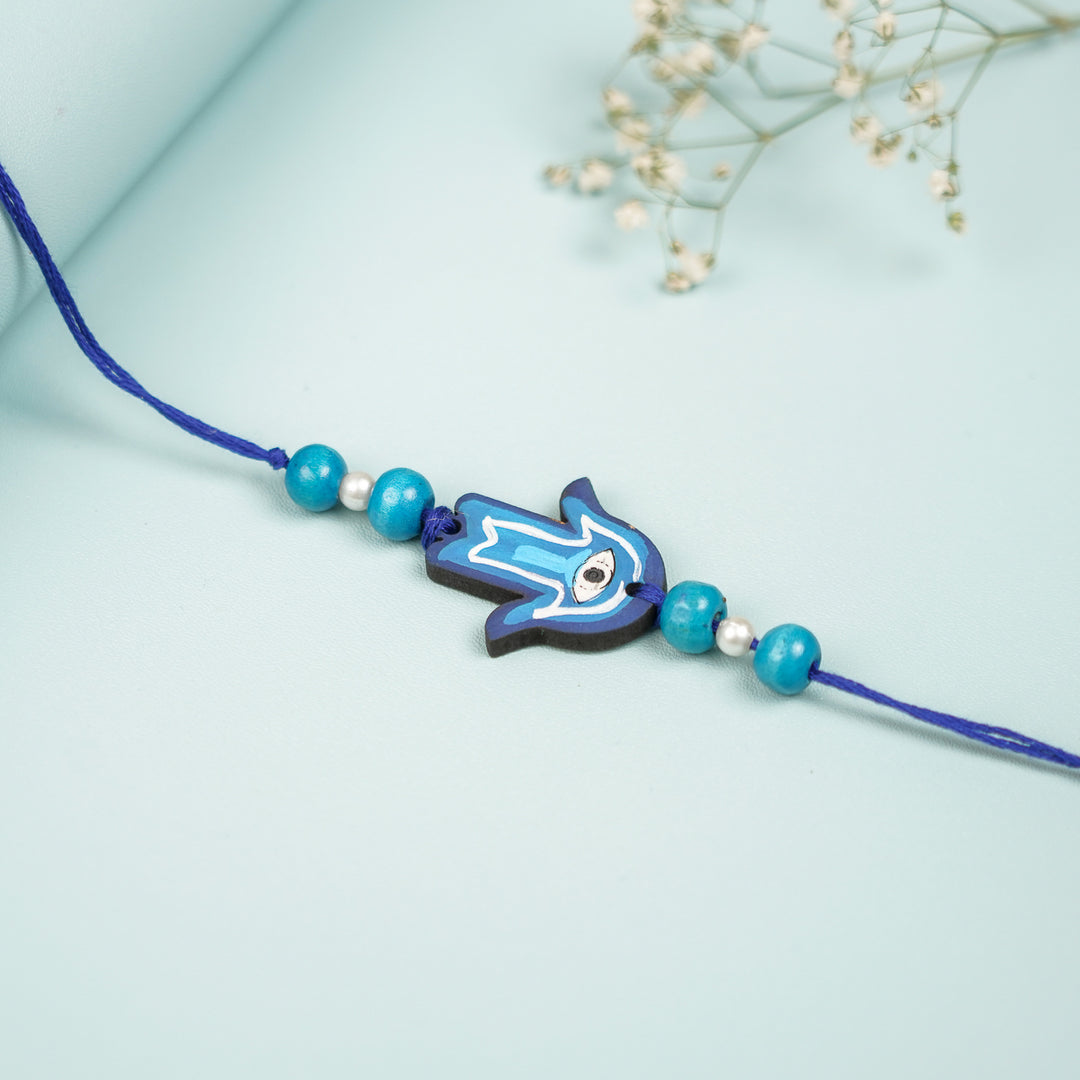 Customized Hand Painted Hamsa Hand Design Mdf Wood Rakhi - Close-up on Surface Display (4)