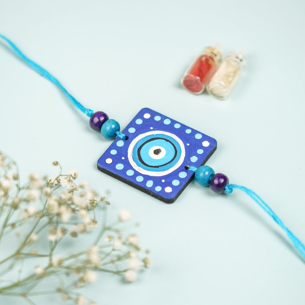 Customized Hand Painted Evil Eye Design Mdf Wood Rakhi - Front View Highlighting Bead Detail