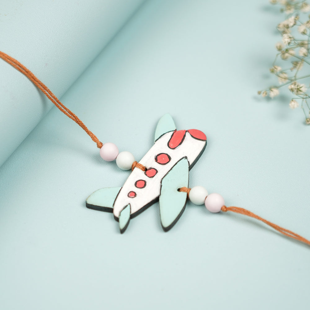 Hand Painted Aeroplane Design Mdf Wood Kids Rakhi - Angled View of Plane Charm Bracelet