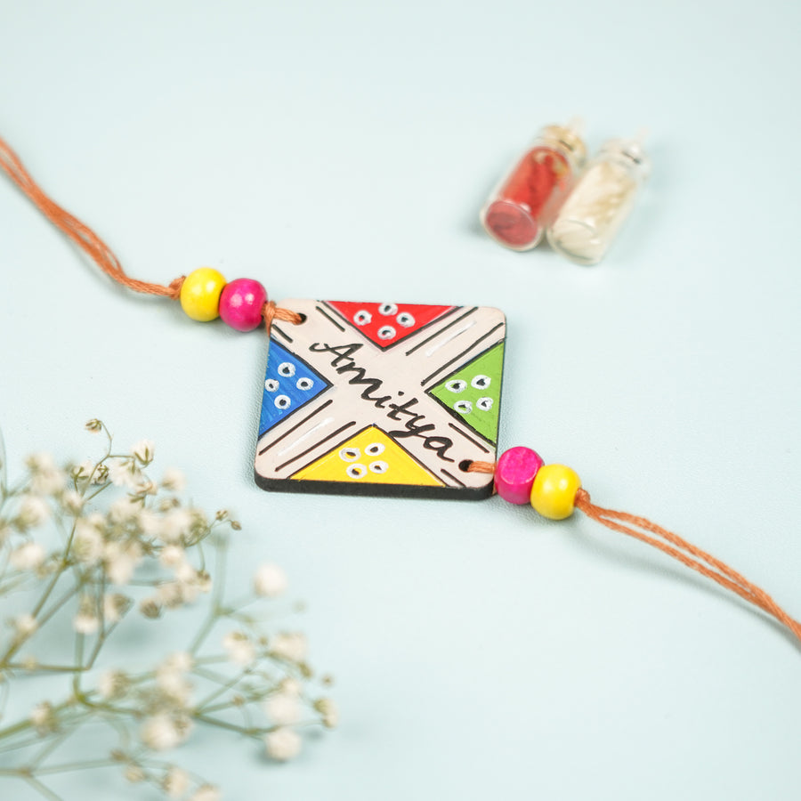 Personalized Hand Painted Ludo Design Mdf Wood Rakhi - Close-up Front View