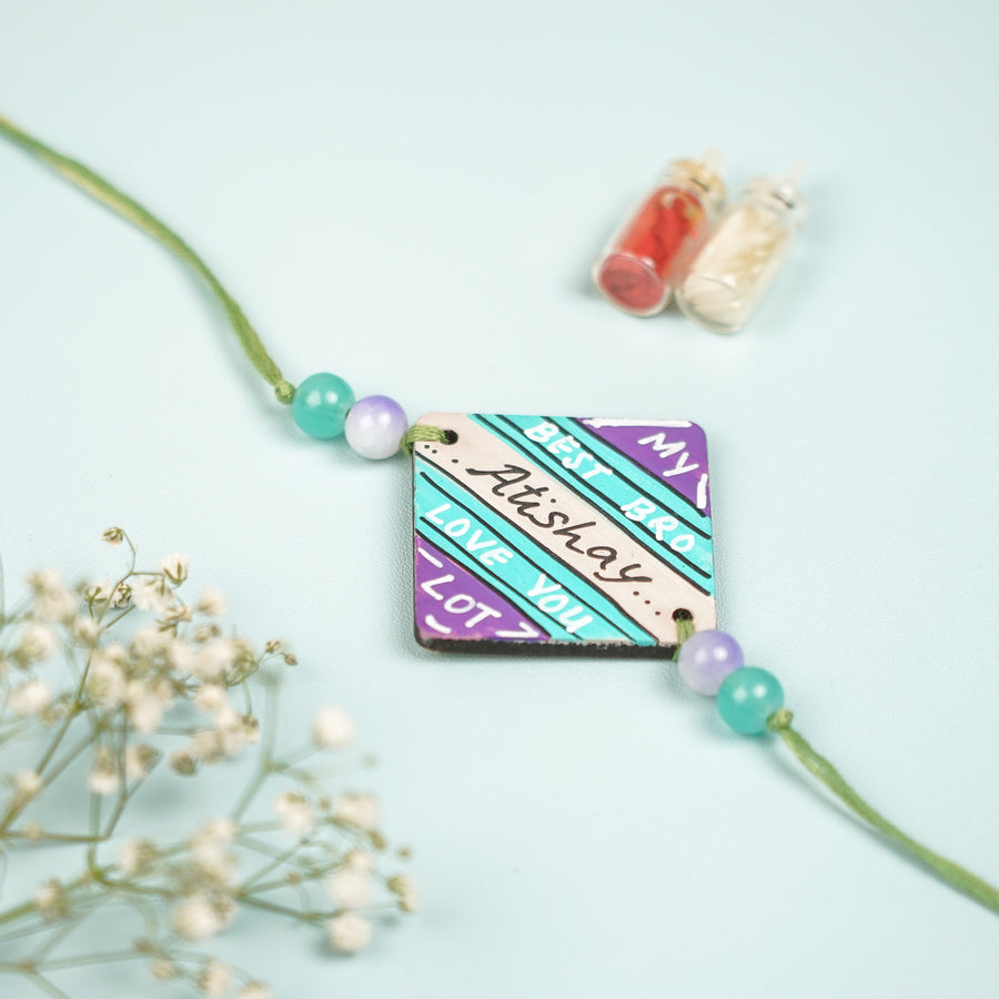 Personalized Hand Painted Round Design Mdf Wood Rakhi - Top View with Decorative Beads