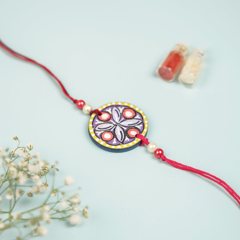 Customized Hand Painted Mandala Design Mdf Wood Rakhi - Front View with Decorative Background (2)