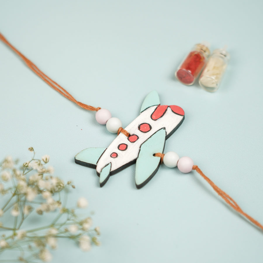 Hand Painted Aeroplane Design Mdf Wood Kids Rakhi - Close-up of Plane Charm Bracelet