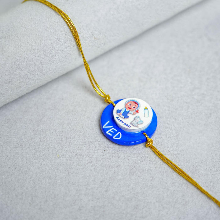 Handmade Personalized Clay Rakhi Keychain With Roli Chawal 1 - Baby Bro Design Close-up