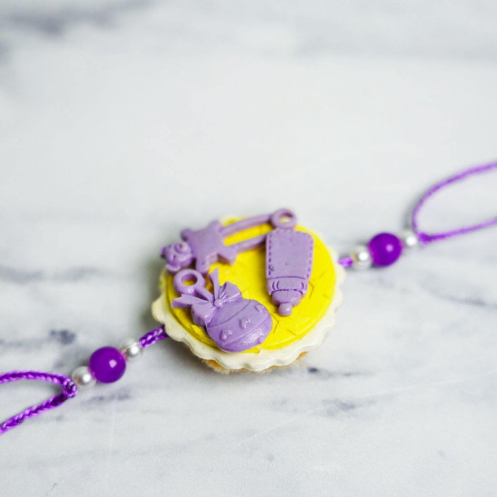 Handmade Porcelain Clay Themed Rakhi 5 - Close-up Angled View