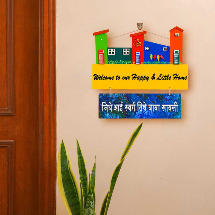Personalized Hand Painted Cityscape Family Mdf Wood Name Plate - Mounted on Wall Above Plant