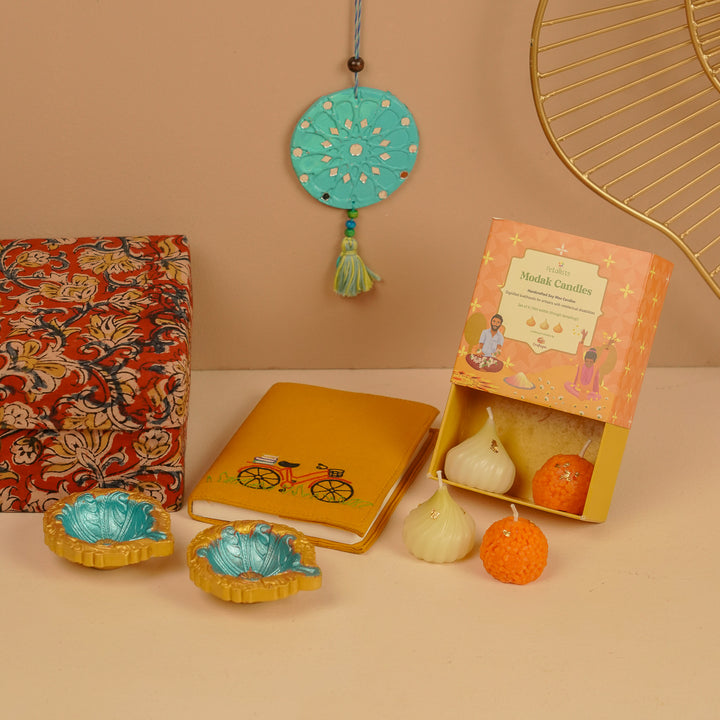 Handmade Diwali Gift Hamper | Includes 1 Notebook, 4 Candles, 2 Diyas, 1 Hanging, 1 Fabric Box
