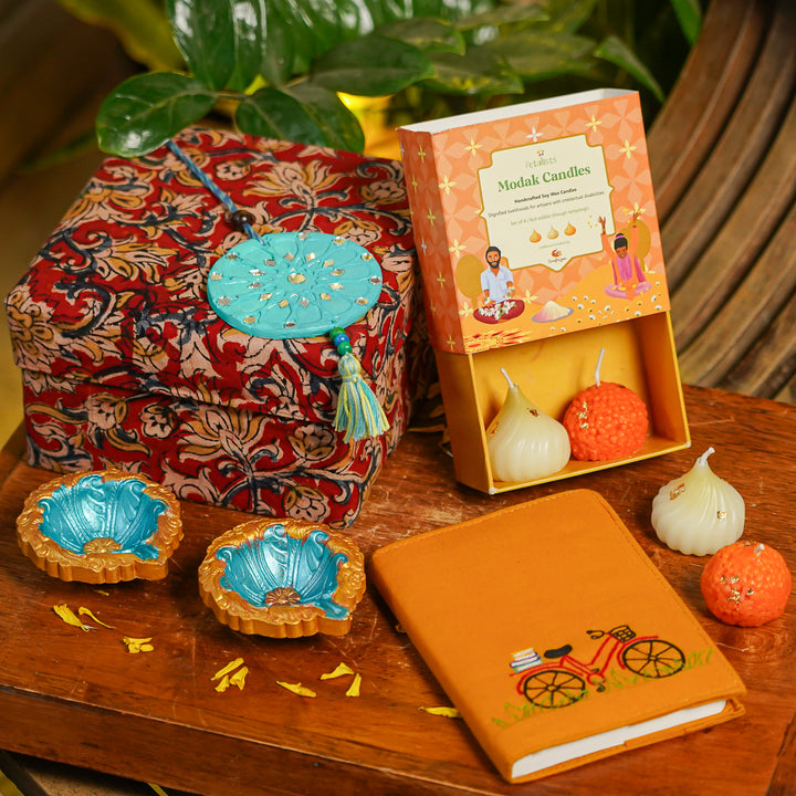 Handmade Diwali Gift Hamper | Includes 1 Notebook, 4 Candles, 2 Diyas, 1 Hanging, 1 Fabric Box
