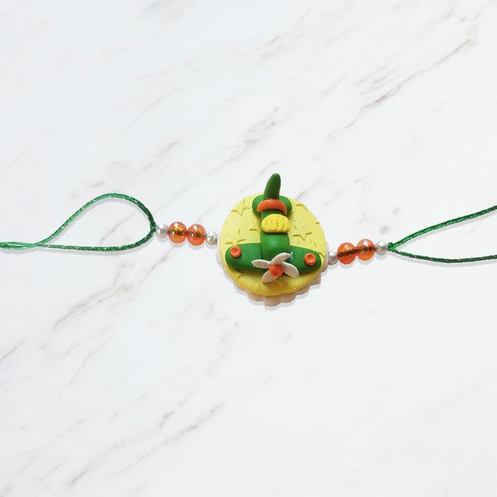 Handmade Porcelain Clay Themed Rakhi 5 - Flat Lay Side View