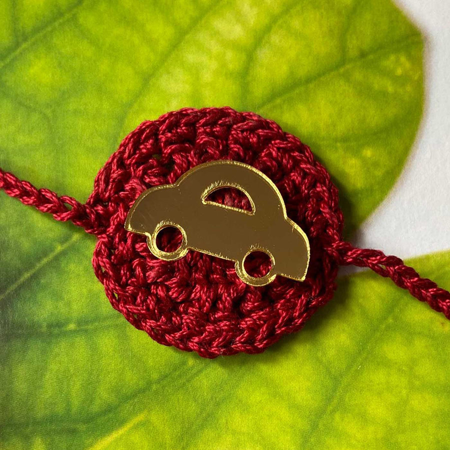 Handmade Crochet Car Theme Cotton Rakhi With Roli Chawal - Close-up of Car Charm Detail