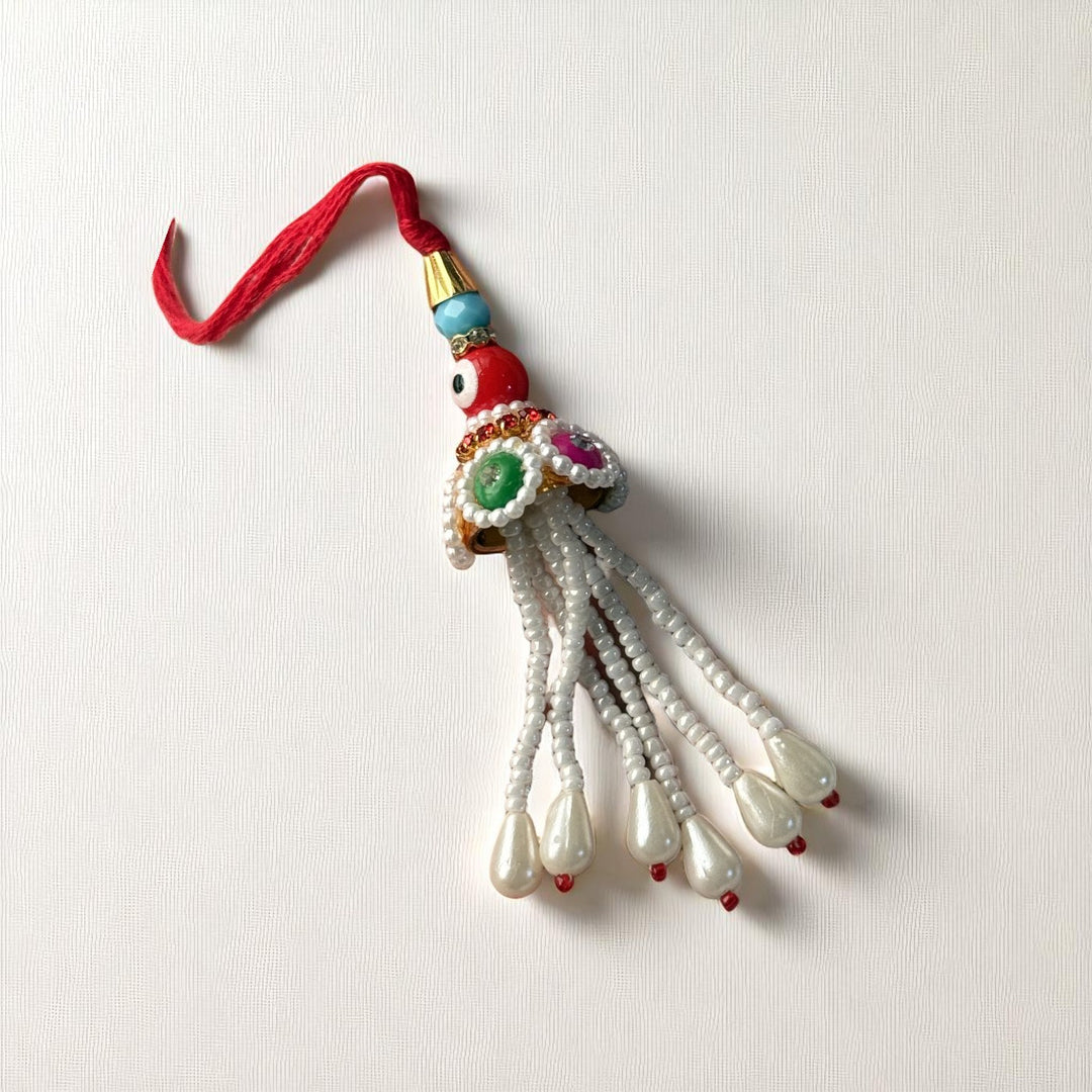 Handmade Red Evil Eye Lumba Rakhi For Bhabhi With Roli Chawal - Front View Isolated On White