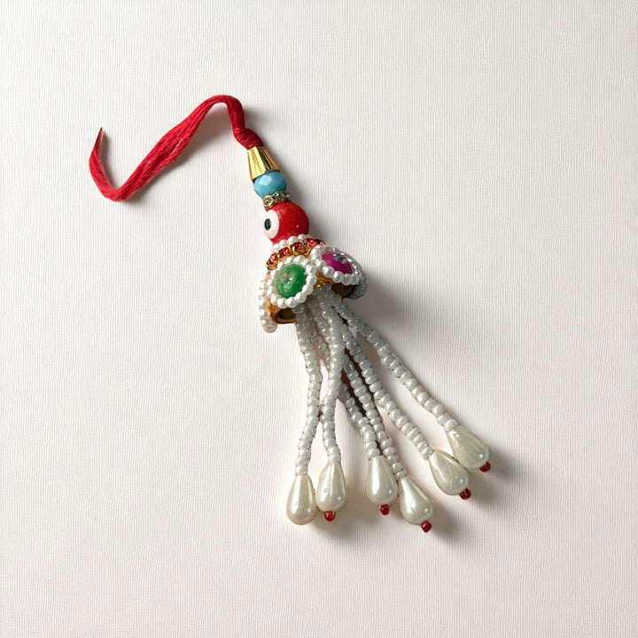 Handmade Red Evil Eye Lumba Rakhi For Bhabhi With Roli Chawal - Front View Isolated On White