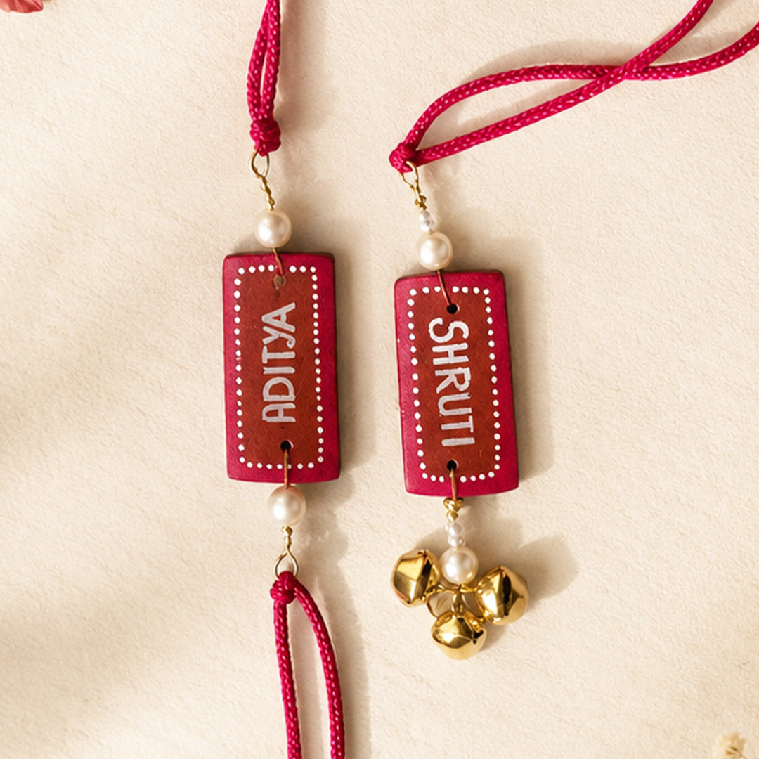 Personalized Terracotta Ghungroo Couple Rakhi With Roli Chawal For Bhaiya Bhabhi | Set Of 2
