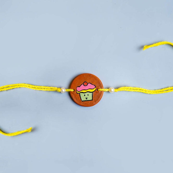 Hand-painted Cupcake Terracotta Rakhi With Roli Chawale
