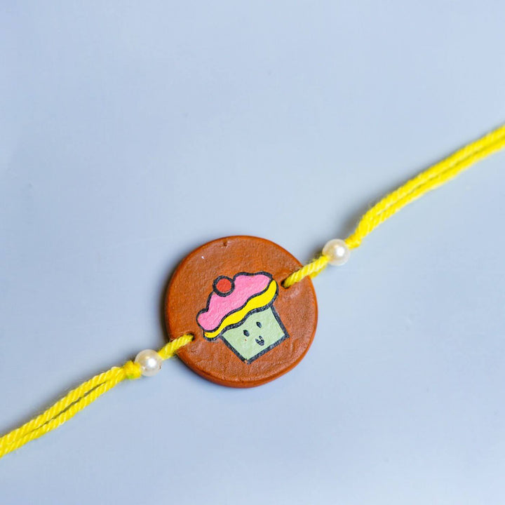 Hand-painted Cupcake Terracotta Rakhi With Roli Chawale