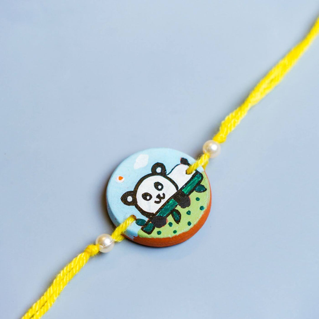 Personalized Animal Theme Terracotta Rakhi With Roli Chawal For Kids 5 - Close-up of Panda Charm