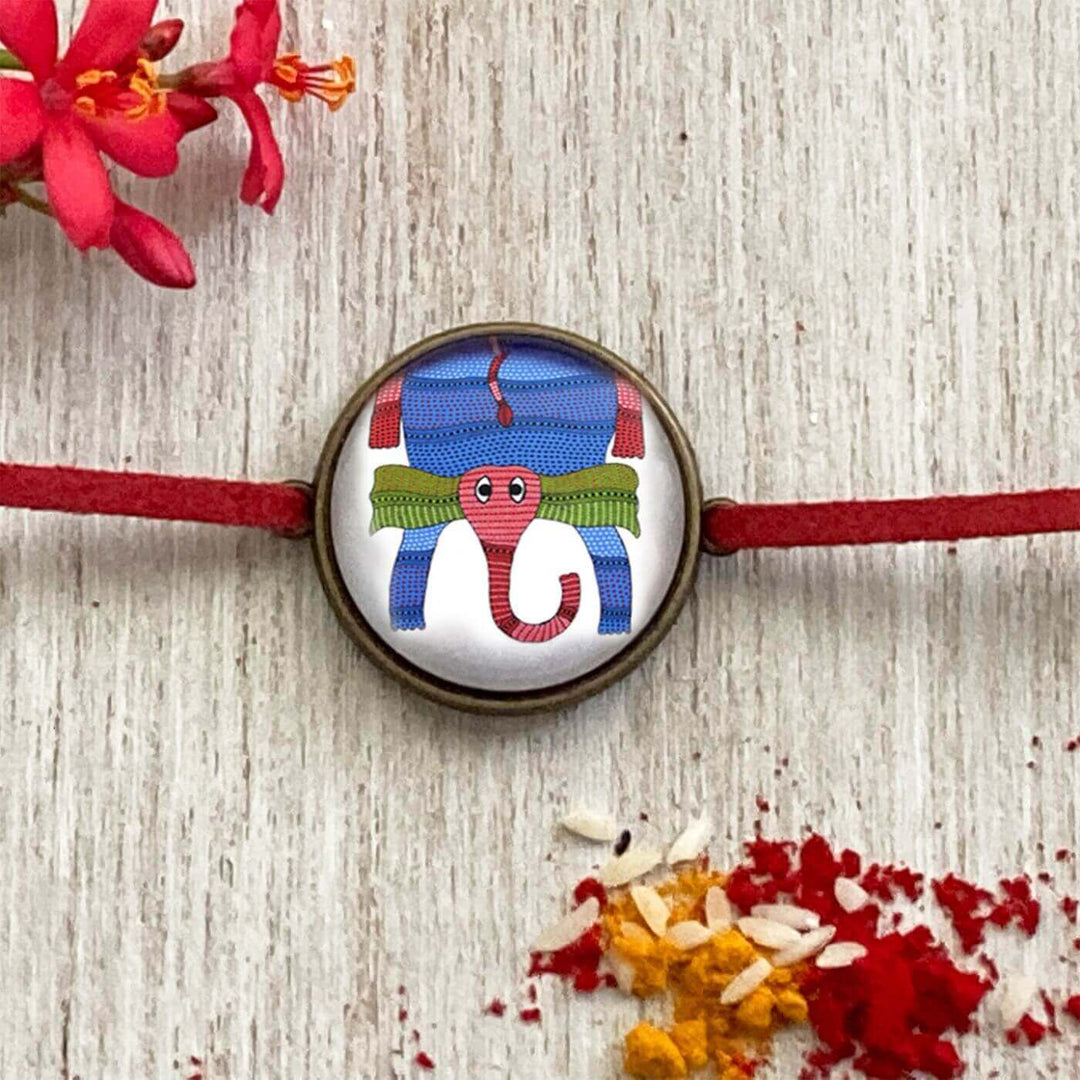 Handcrafted Folk Art Rakhi Hamper For Kids With Rice Roli Haldi 2 - Close-up of rakhi design