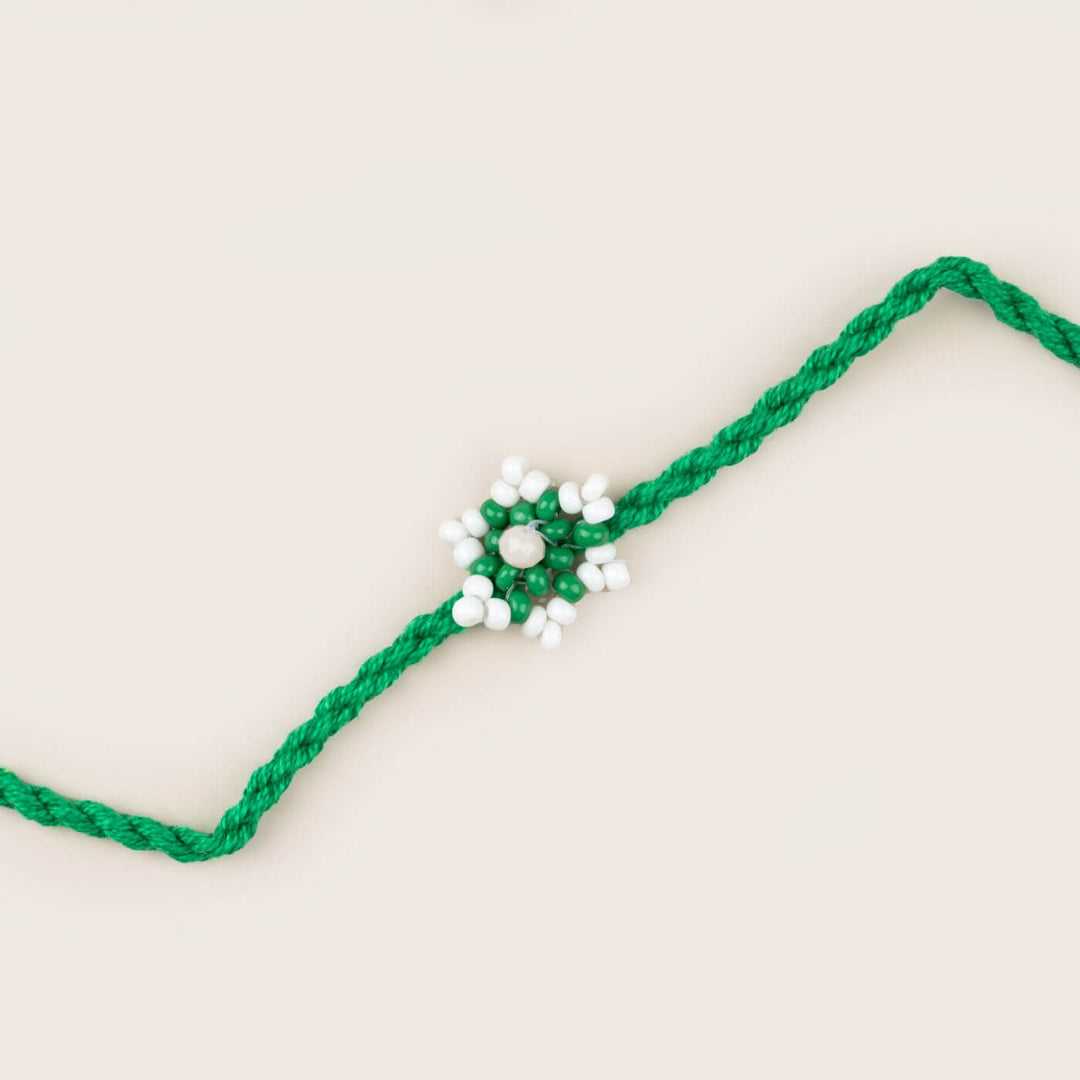 Handcrafted Glass Beads Tara Rakhi 6 - Close-up of green rakhi