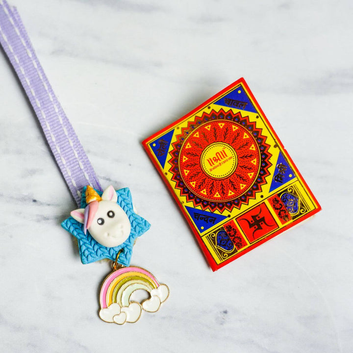Handmade Porcelain Clay Themed Rakhi 6 - Close-up View of Rakhi and Packet