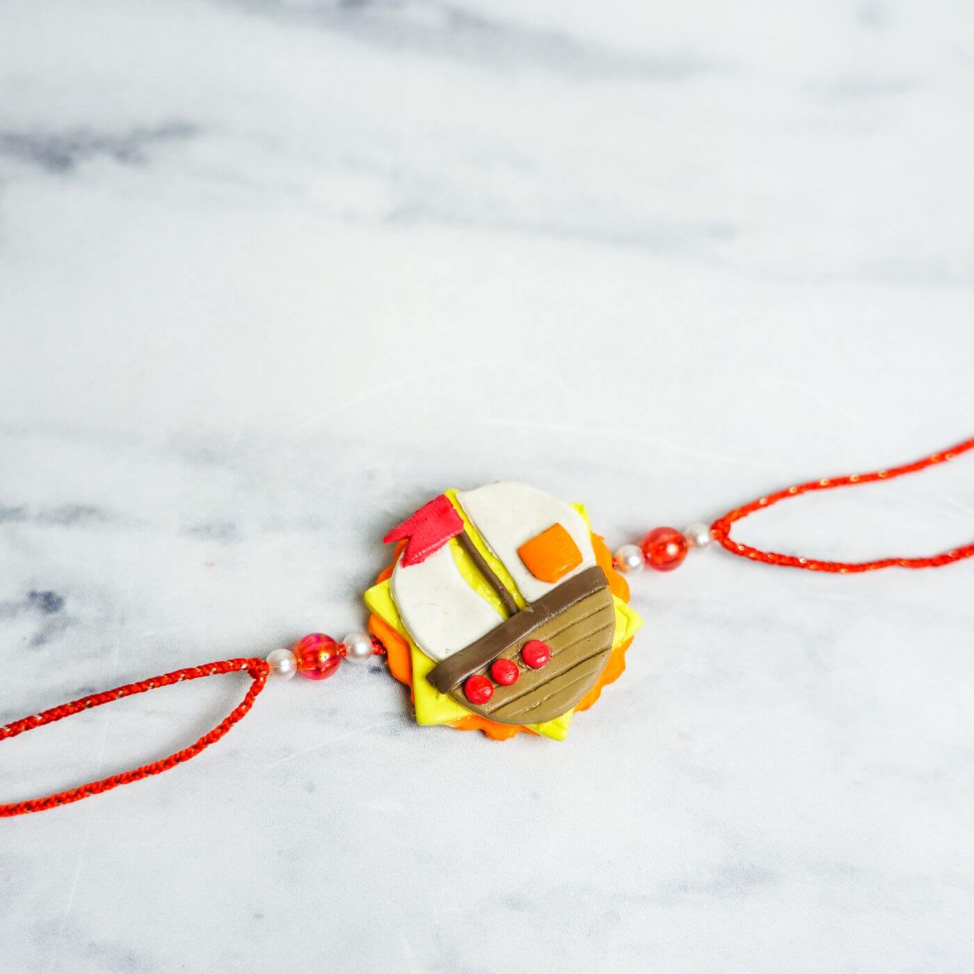 Wooden Flower White Pearl Bracelet Rakhi With Roli Chawal – Traditional Rakshabandhan Gift For Brother