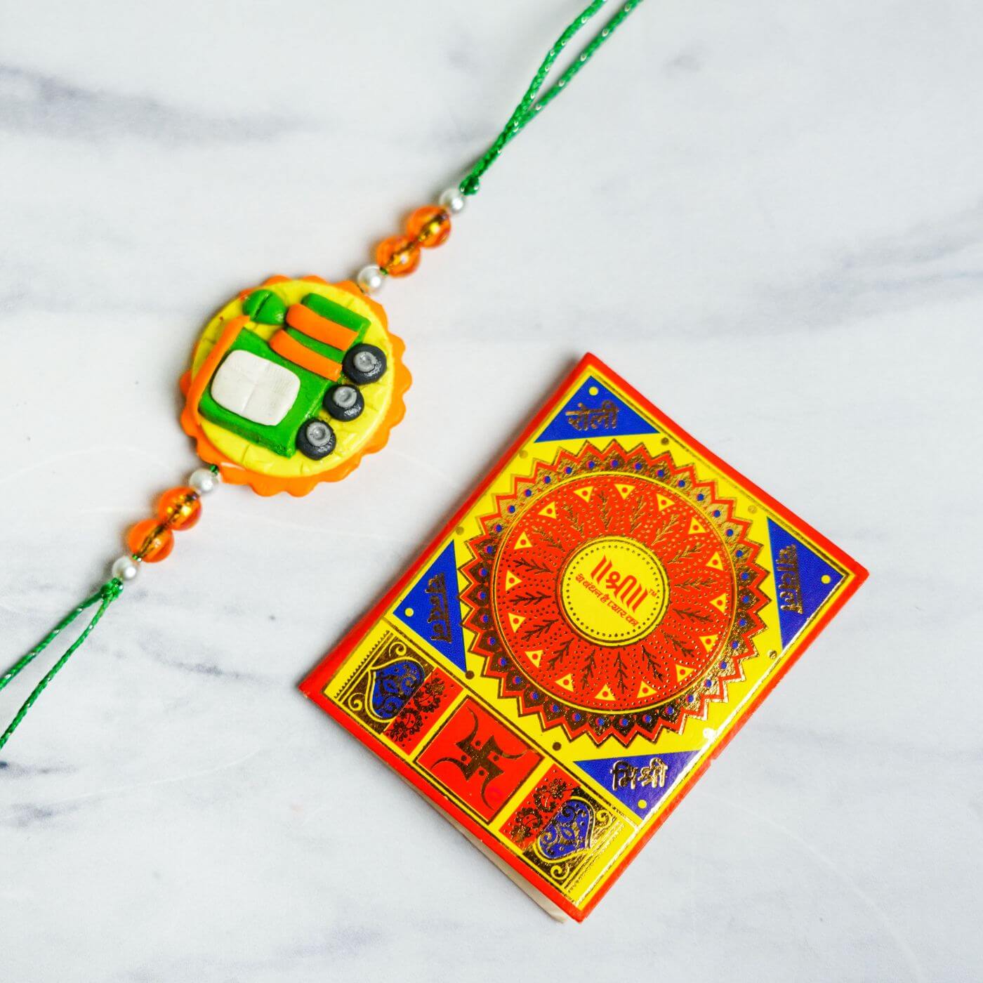 Buy Handmade Porcelain Clay Themed Rakhi With Roli Chawal Online On Zwende