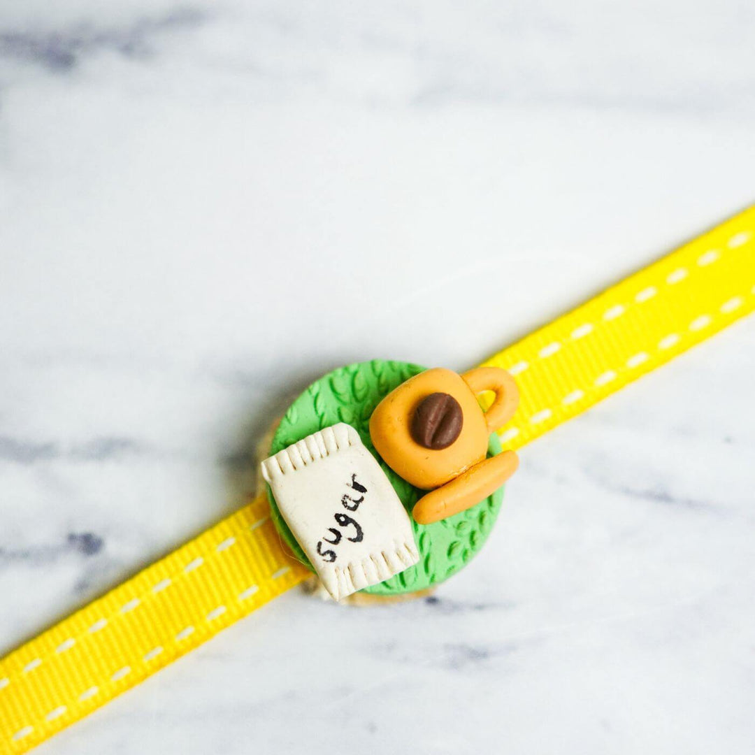 Handmade Porcelain Clay Themed Rakhi 13 - Close-up of charm with coffee cup