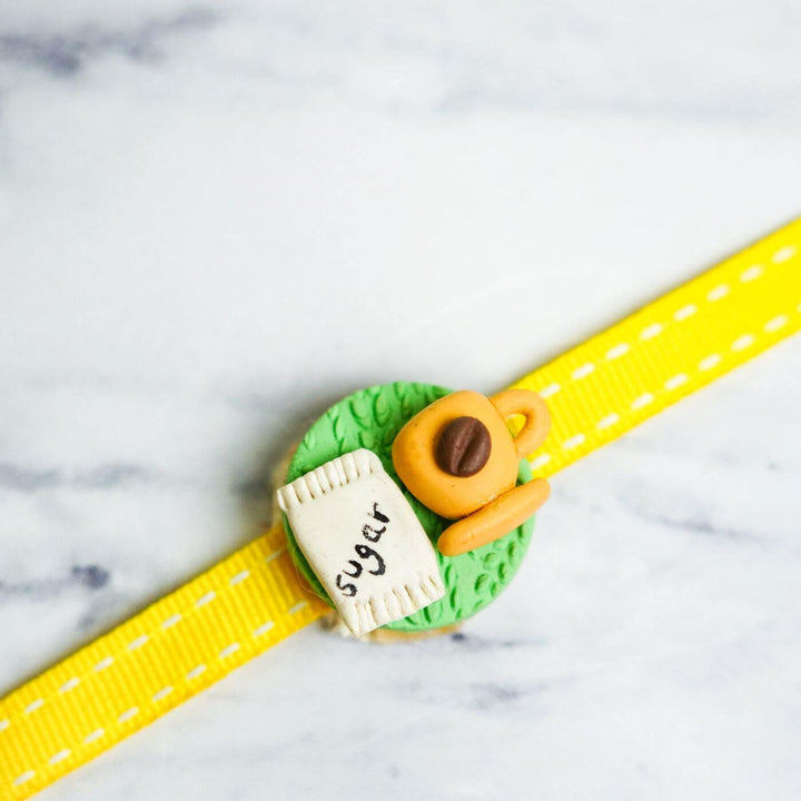 Handmade Porcelain Clay Themed Rakhi 13 - Close-up of charm with coffee cup