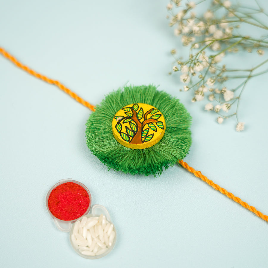 Hand Painted Madhubani Leaves Design Wooden Rakhi With Roli Chawal For Brother - Front View with Accessories