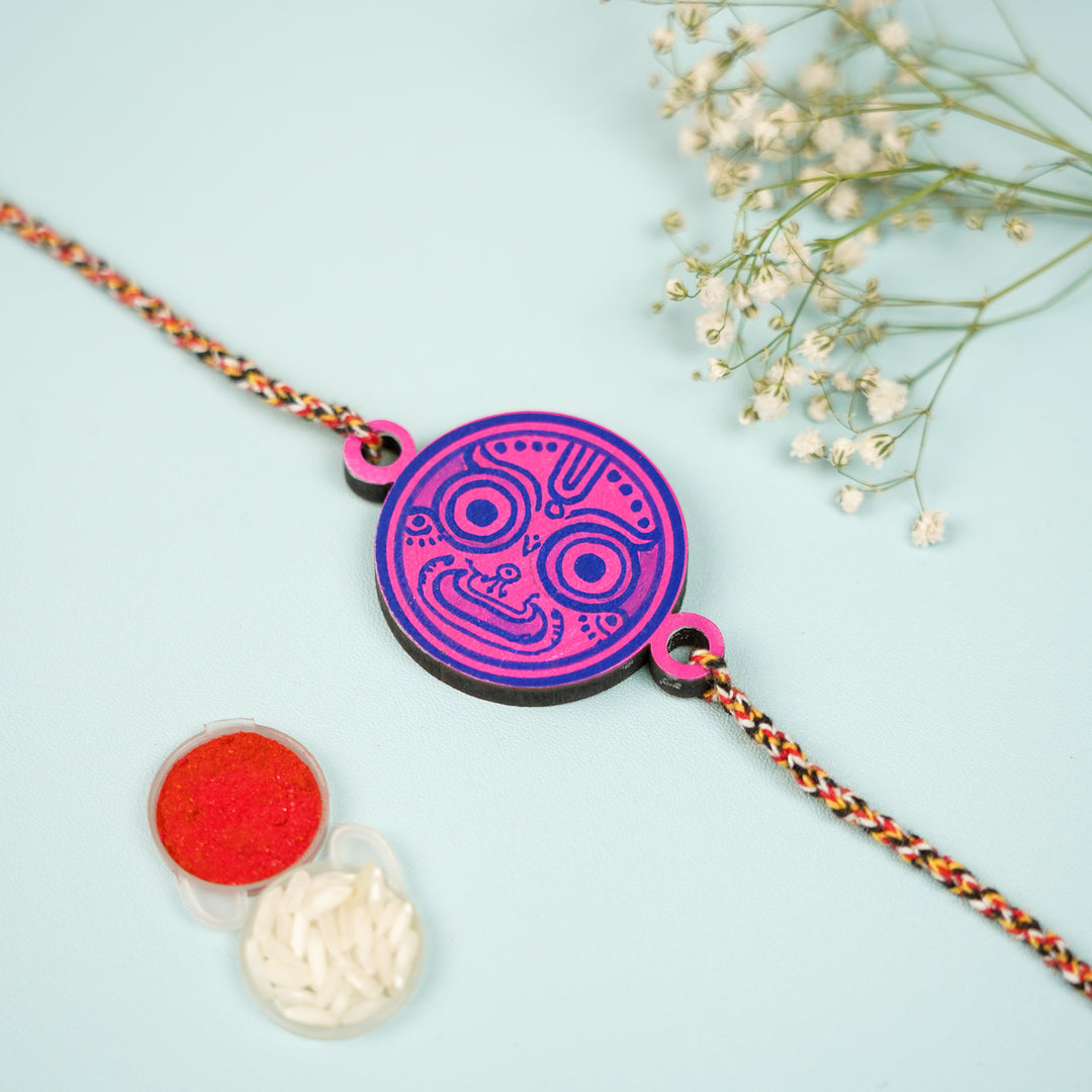 Hand Painted Pattachitra Bhava Nethra Wooden Rakhi With Roli Chawal For Brother - Front View with Accessories