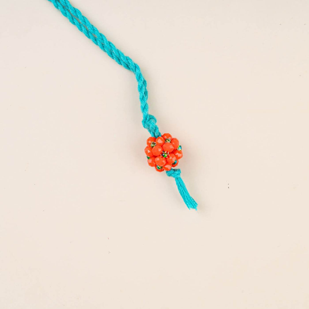 Handcrafted Glass Beads Lumba Rakhi 1 - Orange Beaded Close-up