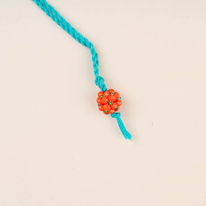 Handcrafted Glass Beads Lumba Rakhi 1 - Orange Beaded Close-up